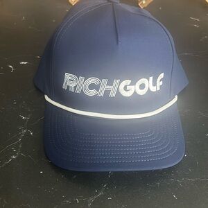 NWOT Rich Golf hat. Never worn. Adjustable